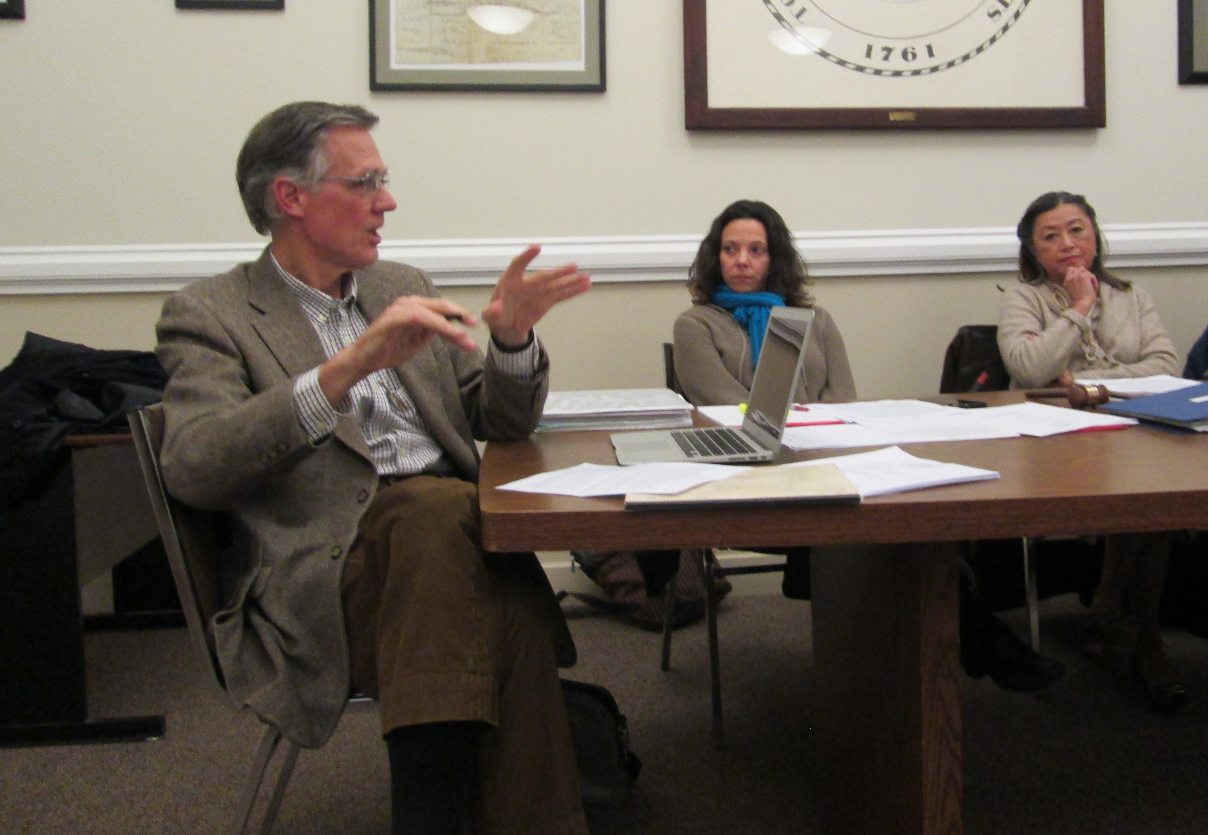 Finance Committee member Michael Wise, left, expresses concerns about the petition, as Leigh Davis and Chair Sharon Gregory listen.
