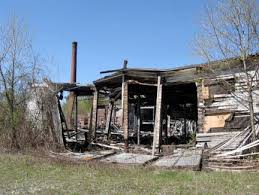 Until the site was cleared for reclamation, charred structures dotted the Log Homes site.