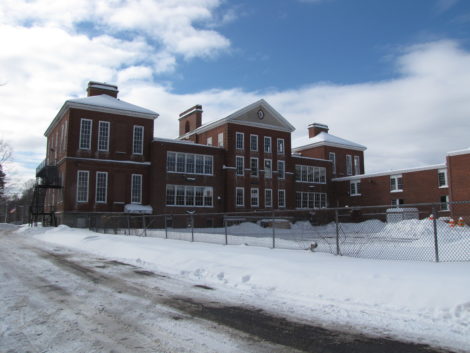 The back of Searles Middle School complex, showing annex at right and the roof of the gymnasium, upper right.