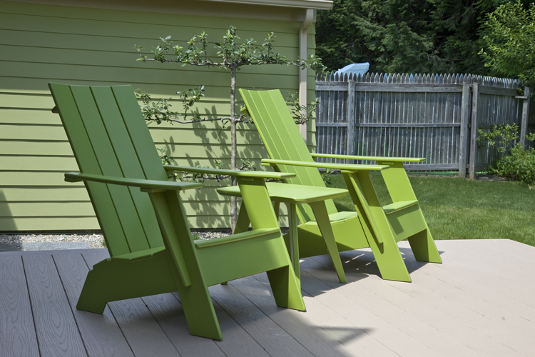 Green Adirondack chairs. Photo: Peter Vanderwarker
