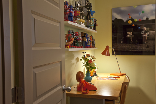 Desk with vintage robots. Photo: Peter Vanderwarker