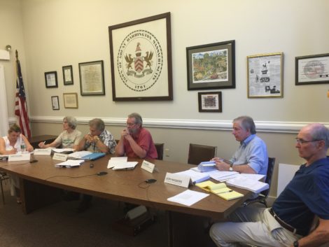 Zoning Board of Appeals listens to Claudia Shapiro: from left, Kathleen Kotleski, Vice Chair Carolyn Ivory, Chairman Ronald Majdalany, John Katz and Donald Hagberg. ZBA member Michael Wise recused himself because he is in the Rotary Club, which sponsors the Bike n’ Fly.