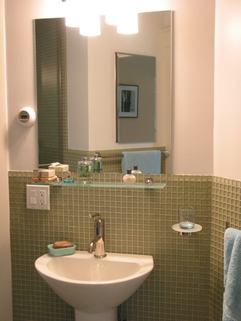 Modern-style powder room built into a walk-through. Photo: Erica Fay