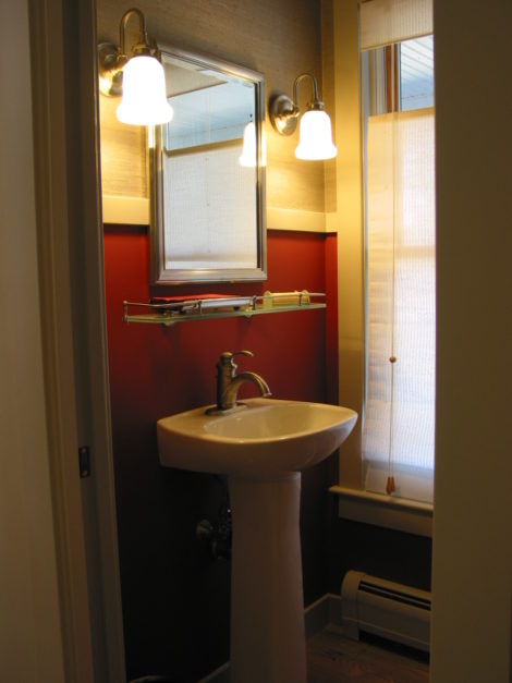 A powder room fitted into redesigned unused bedroom. Photo: Erica Fay
