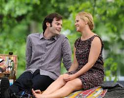 Bill Hader, as a sports medicine physician, and Amy Schumer as the journalist Amy Townsend.