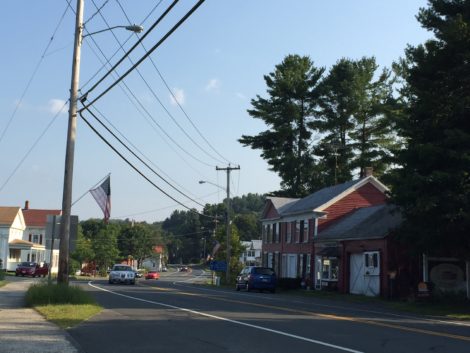 The town of Otis intends to provide each household with a high-speed Internet connection, utilizing fiber optic cable strung from poles such as these on Route 8.