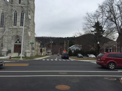 Across Main Street from Ried Cleaners is Dresser Street. At left, St. Peter's Church; at right, the Mason Library. Dresser Street leads straight to the Housatonic River.