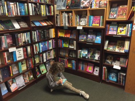 A young customer in the children/young adult section.