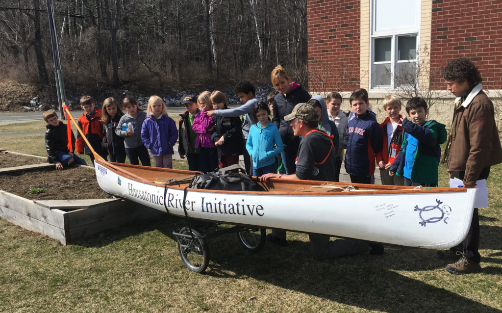 Alsop explains how he made the canoe, and how he sleeps in it at night, beneath an inflatable tent.