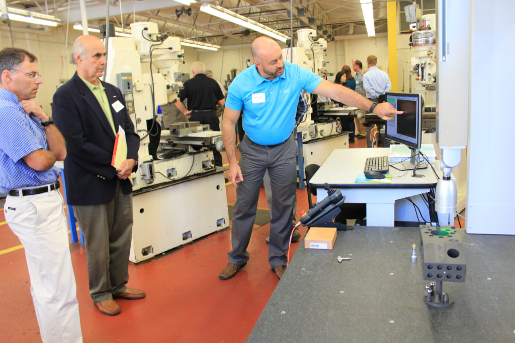 Shawn Grady of Hexagon Metrology demonstrates the Hexagon Global Performance Silver Edition Coordinate Measurement Machine at a Berkshire Innovation Center event on Thursday, Sept. 15. The machine features technology essential in quality control in the medical device and aircraft industries.