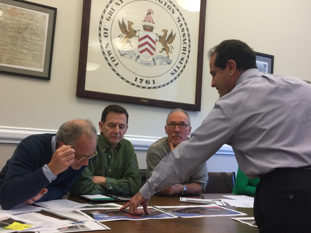 Benchmark Development’s Michael Charles (right) explains the plans to Design Advisory Committee members Stephan Green (left), Gaetan Lachance (center) and Stephen Dietemann. Photo: Heather Bellow.