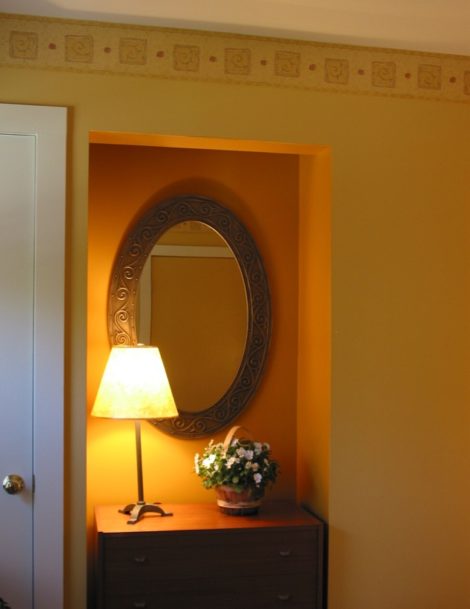 Here is an alcove in a bedroom at the former Silo B&B in North Egremont. A deeper shade of gold was used in the recesses to create interest. Trim: “Cameo White”; walls: “Amber Waves”; accented alcoves, “Peanut Butter”. In the adjoining bath, the same colors were used in an opposite way with the deeper color for the main walls and the lighter for accents.