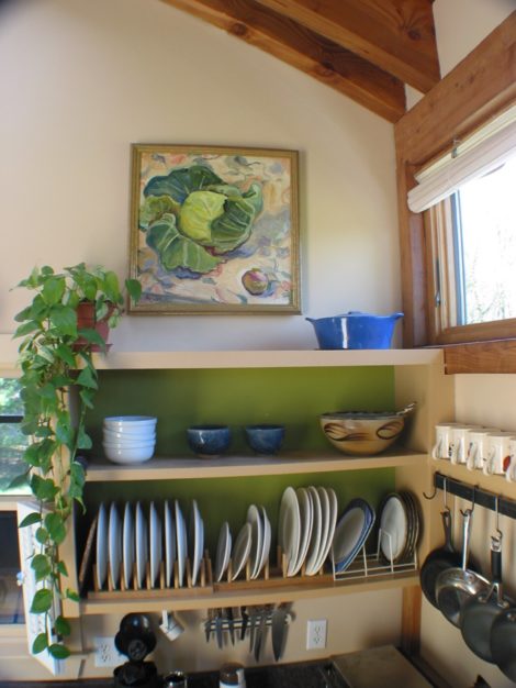“Forest Moss” is used behind the open dish selves here in a kitchen in Egremont. The walls are “Yellow Squash” and the trim is “Acorn Yellow”. The oil painting is by Kate Knapp.