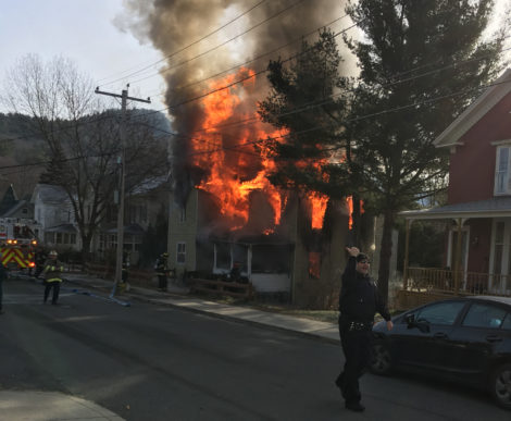 The house on Dresser Avenue fully involved from which a 76-year-old man was rescued. Photo: David Scribner