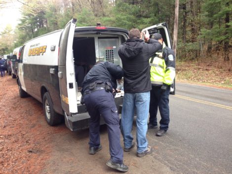 A protester being put into a Berkshire County Sheriff's van. Photo: Will Elwell