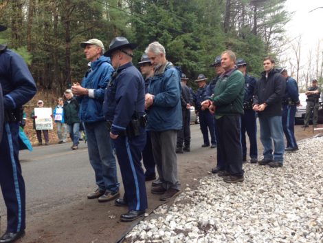 Handcuffed protesters being led to sheriff's vans for transport to the Berkshire County Jail.