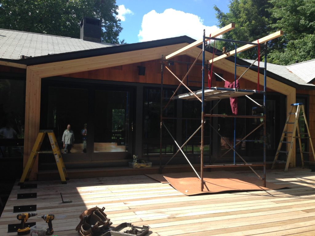 Aligning screen porch structure with existing roof lines and building upon the previously constructed reinforced deck. - Photo: Michael Alper