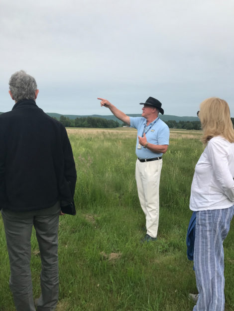 Airport operations manager Kenneth Krentsa points to the location of the new hangars during a tour of the airport property. Photo: Victor Feldman