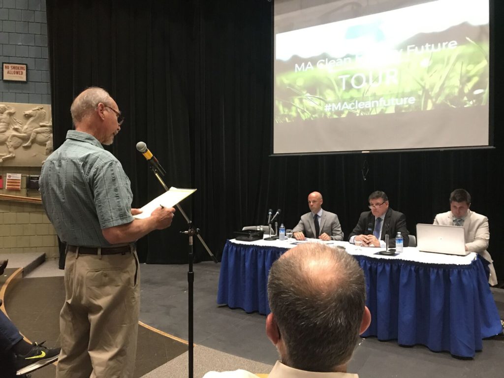 A Berkshire County resident reads testimony on the perils of living near a wind turbine. Photo: Victor Feldman