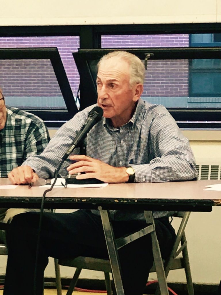 Finance committee member Ed Scarbro voices concerns on Article 5 of the meeting's agenda. Photo: Victor Feldman