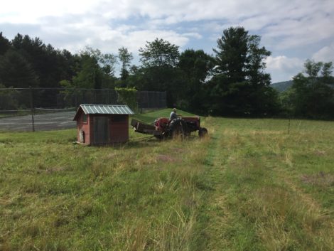 Some chicken houses get hauled by the tractor.