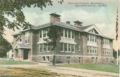 A historic representation of the Housatonic Elementary School, as depicted in a colorized postcard, printed for Lennons Drug Store in Housatonic.