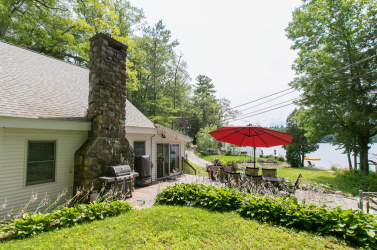 Sunny immaculate 4 bedroom Cape with direct access to Lake Buel