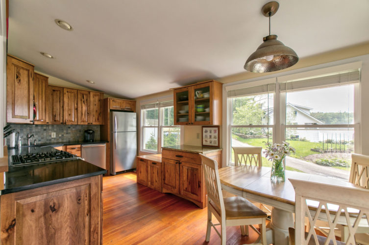 Sunny immaculate 4 bedroom Cape with direct access to Lake Buel