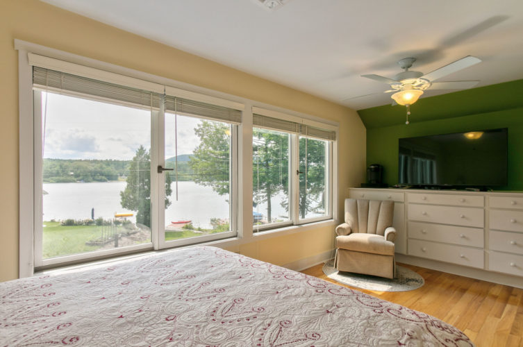 Sunny immaculate 4 bedroom Cape with direct access to Lake Buel